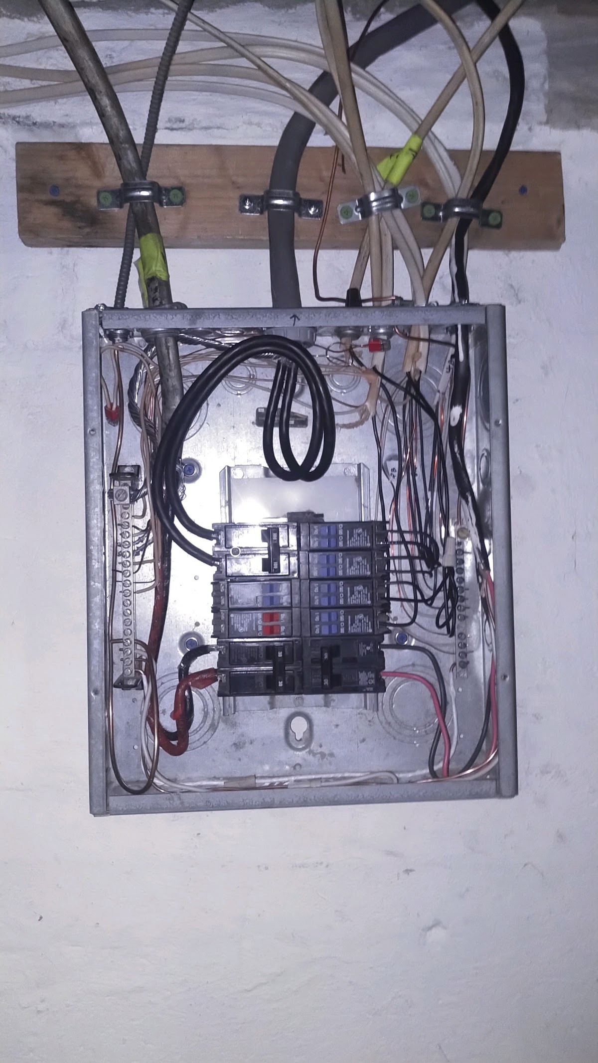 Open breaker panel during a wiring job