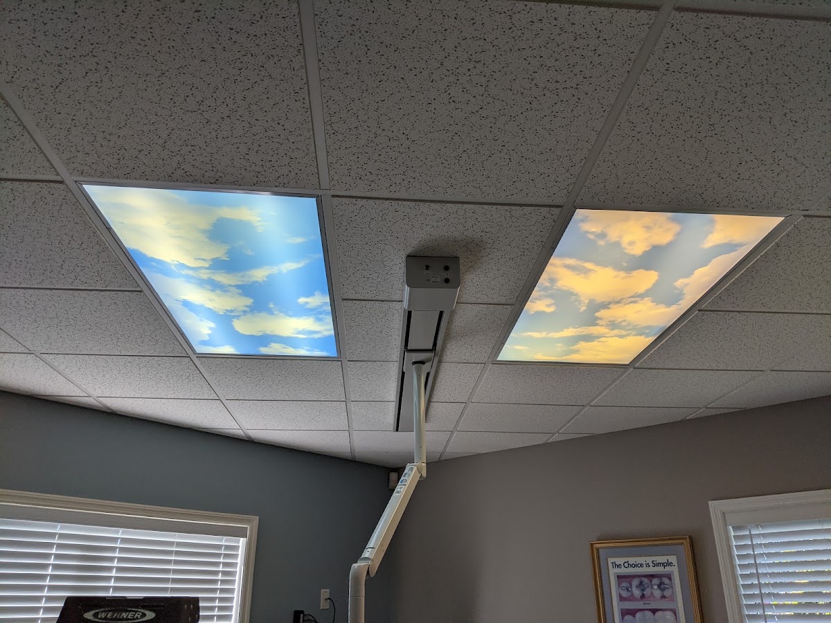 Cloud-scene LED sky panels installed in an office ceiling
